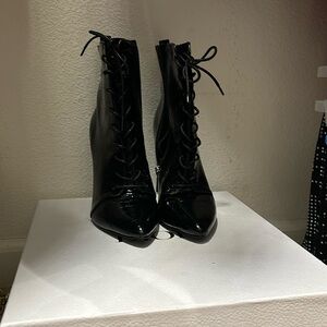 Charles Davis black crocodile booties.